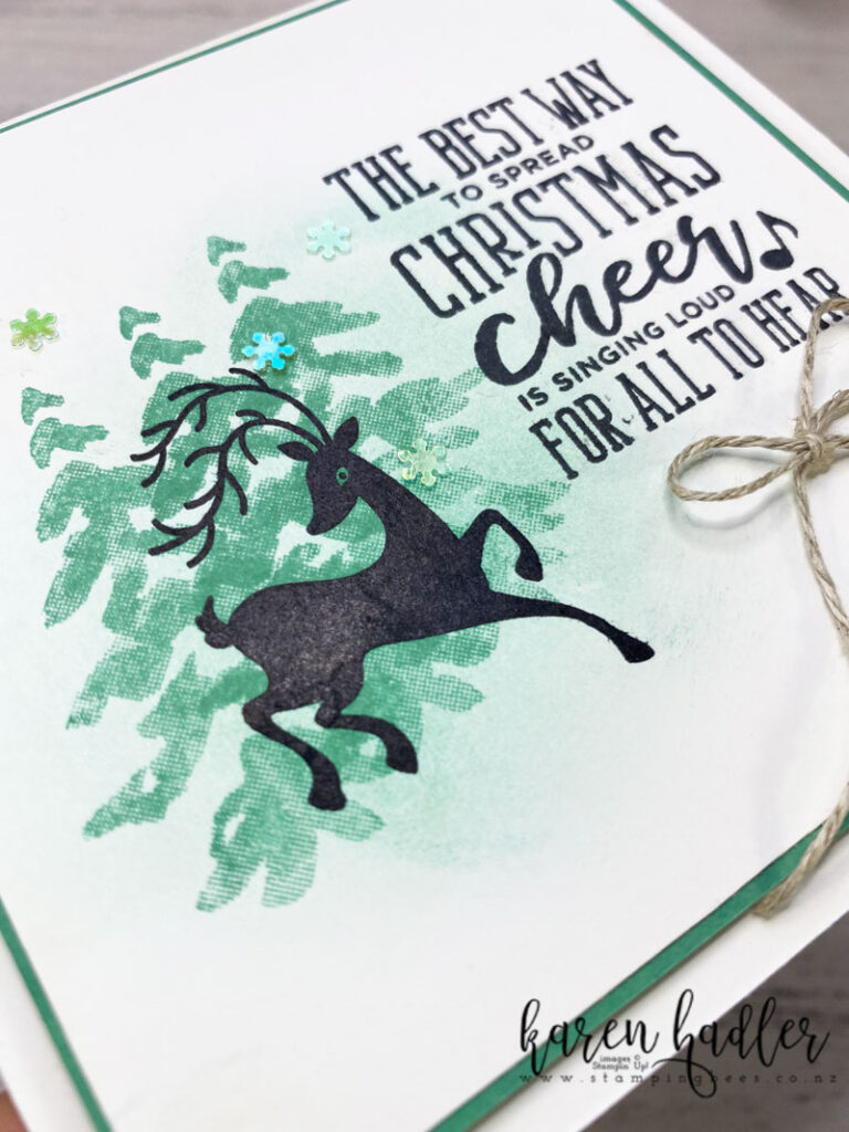 Close up of the sponging and stamping off. Using Festive Post, Christmas means more and In the pines.