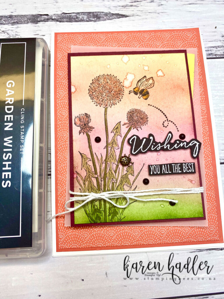 A wishing you all the best sentiment White embossed on Black Card stock. There are 5 layers progressively getting smaller. The Blended sunrise has  t a dandelion and bee