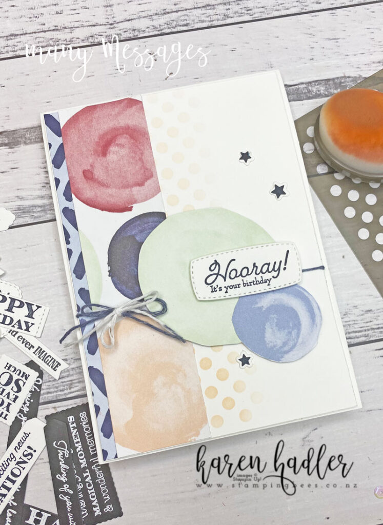 23 Ready to Go Messages in a Flash card. White background with small pink dots. one small b;ue stip of DSP the left hand side and one larger with circles. There are two circles cut out with a sentiment label that says Hooray it is your Birthday. the card also has 3 little stars.