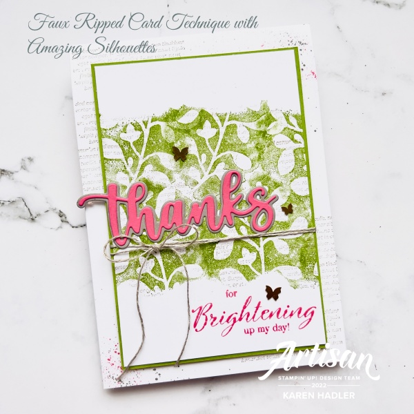 A picture of a card with with text. This is a white green and pink card. There are green and white leaves in the middle of the card and the word thanks in large letters across the middle. There is also some twine tied around the centre with a bow.