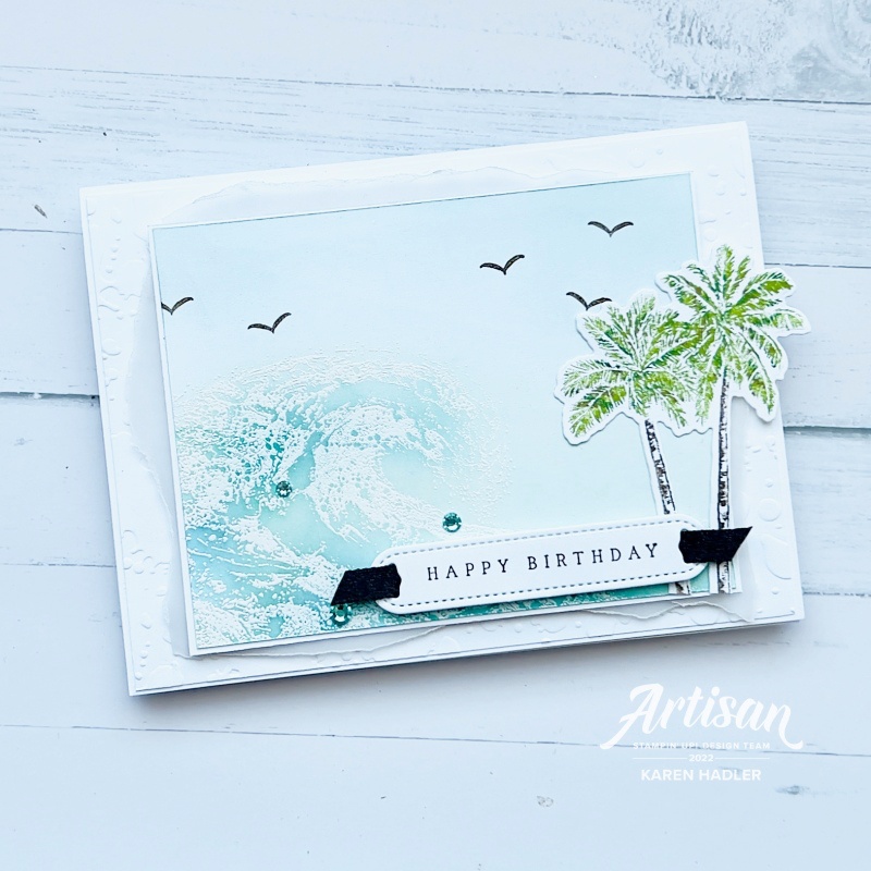 A Birthday card with palm trees and ocean waves.