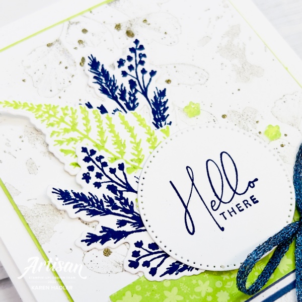 A close up picture of a greeting card blues, greens and whites that says Hello there