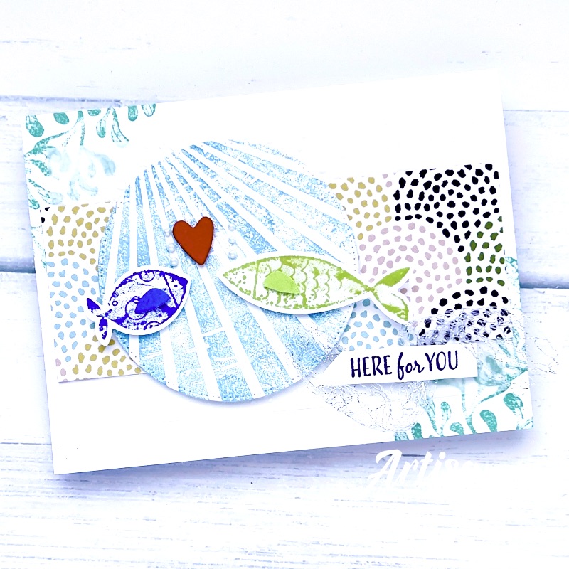 A picture of a Greeting card with 2 colourful fish swimming in the Ocean and the sentiment is Here For You 