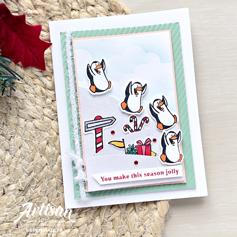 A picture of a Christmas card with Penguins sliding down glimmer white hills . The sentiment reads you make this season jolly.