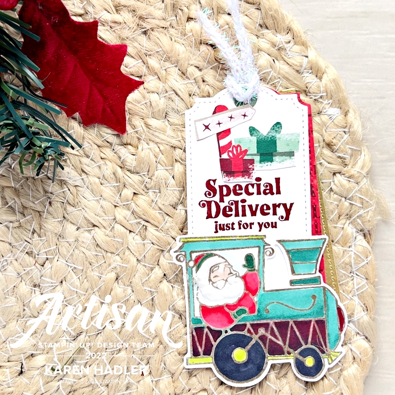 A picture of a Christmas tag that reads Special delivery just for you. There is a Santa in the front carriage of a train waving.