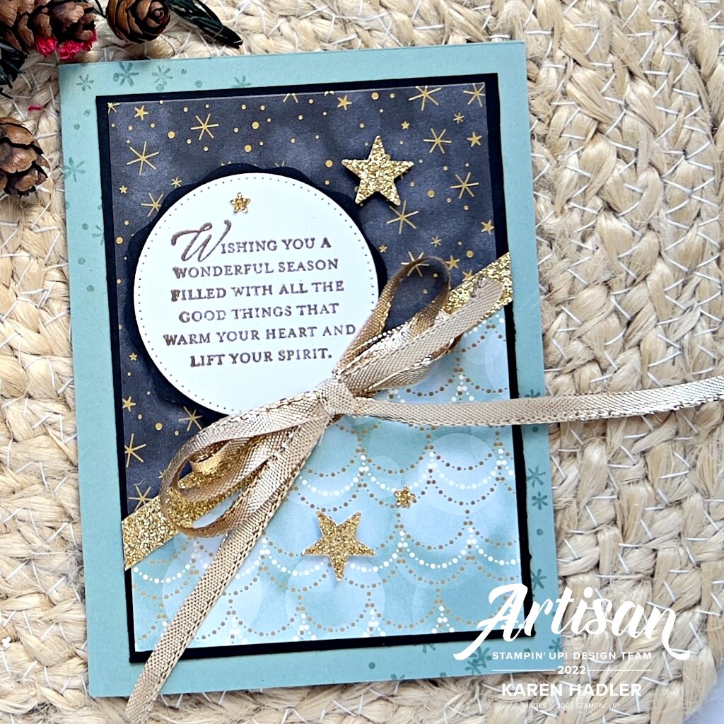 A Christmas Greeting card in Green and Gold, with Gold stars and a large gold double bow. 