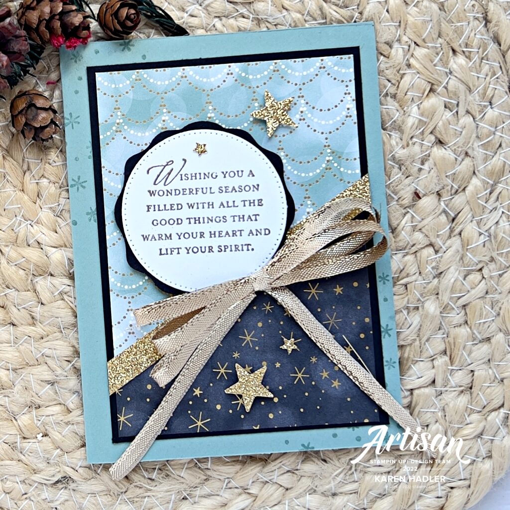 A Christmas Greeting card in Green and Gold, with Gold stars and a large gold double bow. 