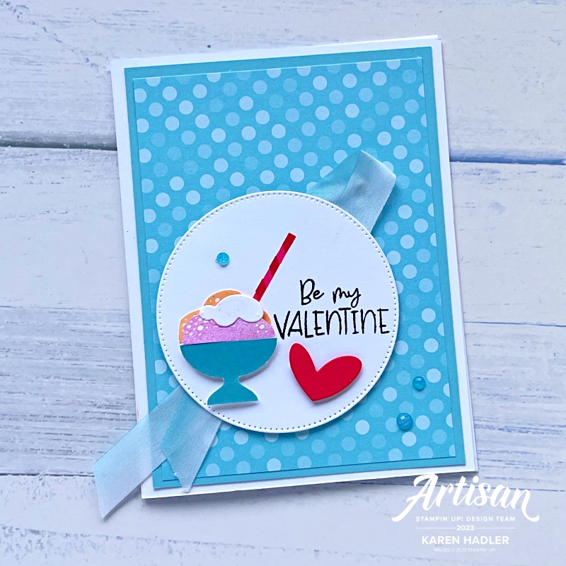 A picture of a Balmy Blue Greeting card with a circle as a focal point and in that circle is an icecream sundae with a straw and a red heart. The sentiment reads Be My Valentine.