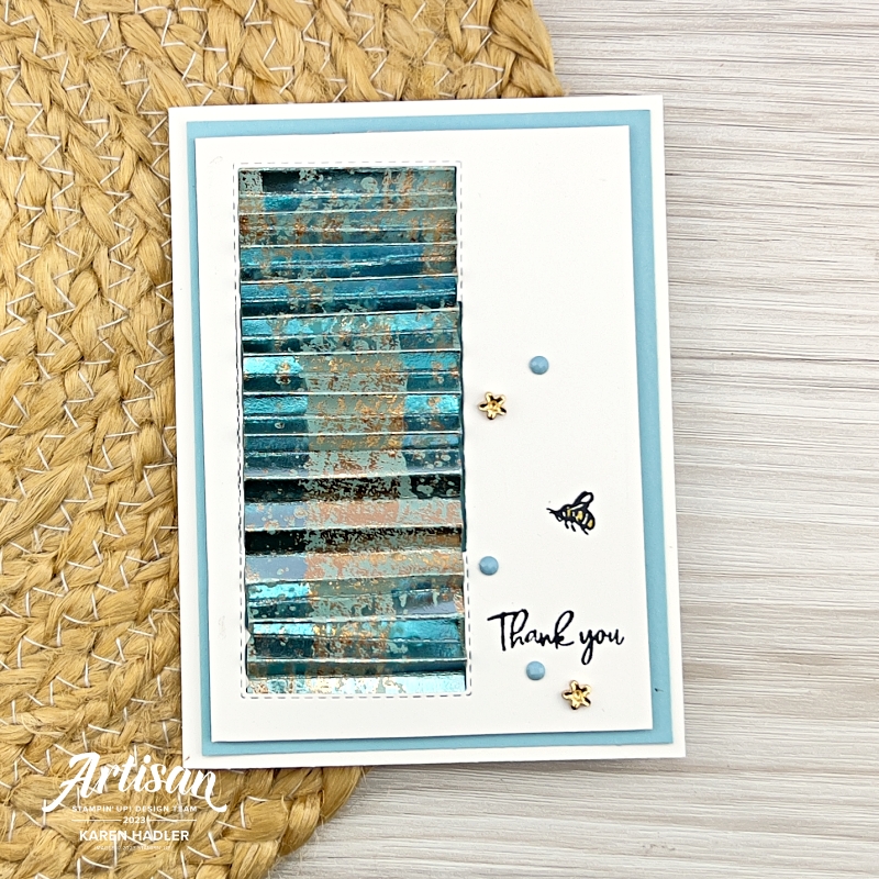 A picture of a greeting card that reads Thank You and a small Bee. On the left is beautiful concertinaed Designer Series paper. 