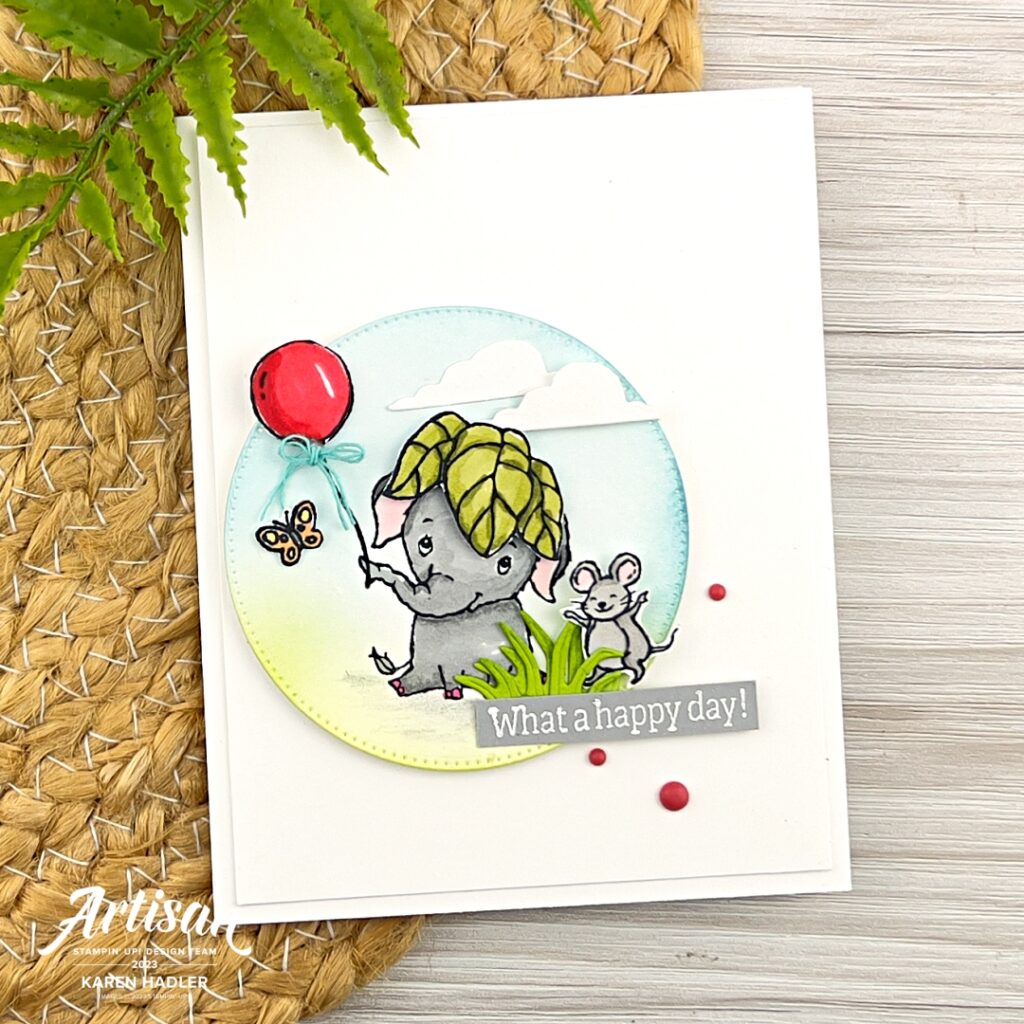 A picture of a Birthday card with a elephant with a leaf on it's head holding a balloon and a little mouse beside it.