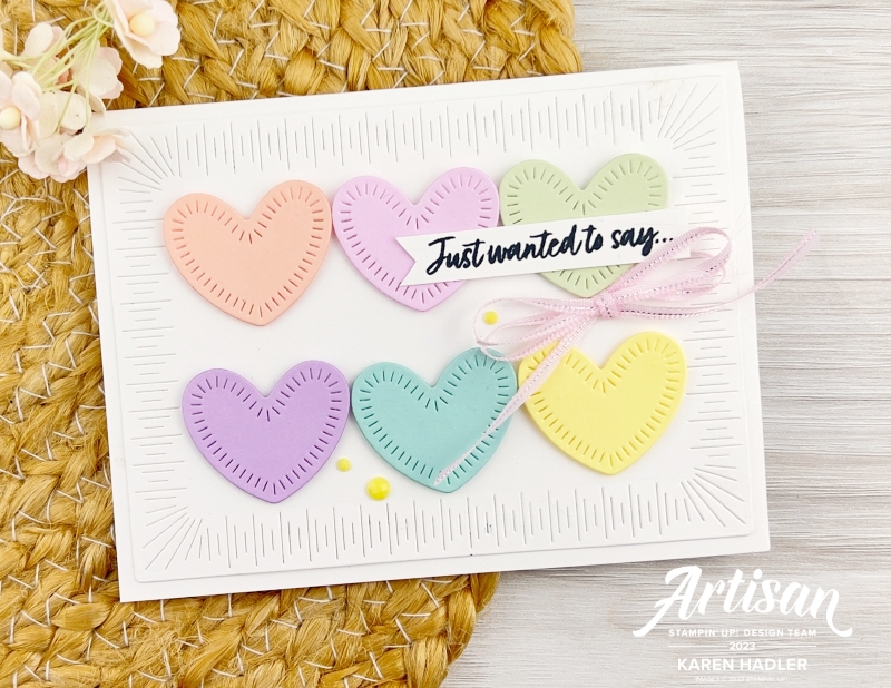 A white greeting card with stitching around the border. Inside is pastel hearts , Petal Pink. bubblebath, lemon Lolly, Soft sea foam, pool party and  fresh freesia. The sentiment reads I just wanted to say ...