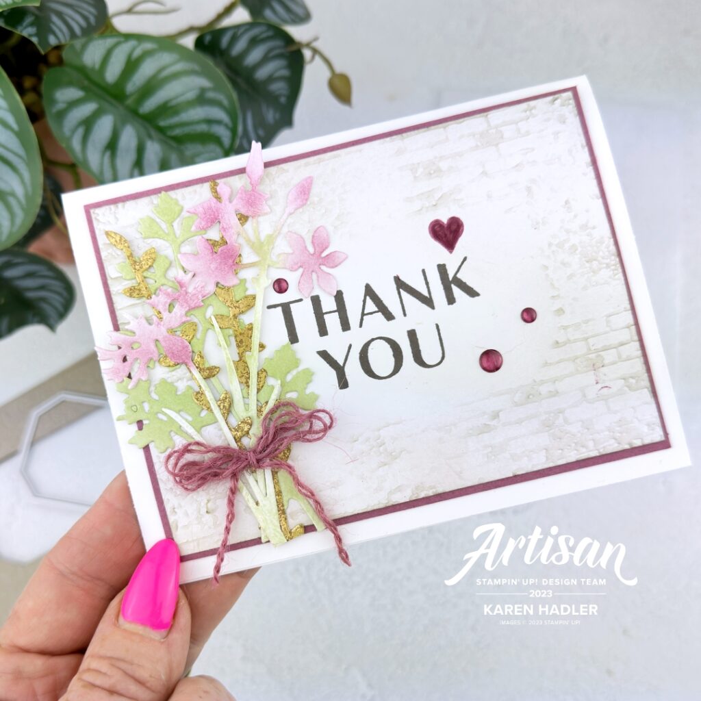 A greeting card with a large Thank You  in the middle . This is onl flat card stock and the area around is embossed and stamped with flowers and leaves