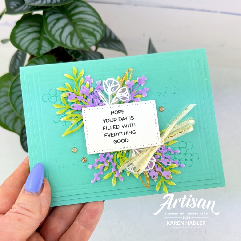A Coastal Cabana Greeting card that reads Hope Your Day is Filled with Everything Good. Under the sentiment are layers of leaves and flowers all around it. This is in the centre. Around the edge the cardstock has been scored to look as though there are many layers.