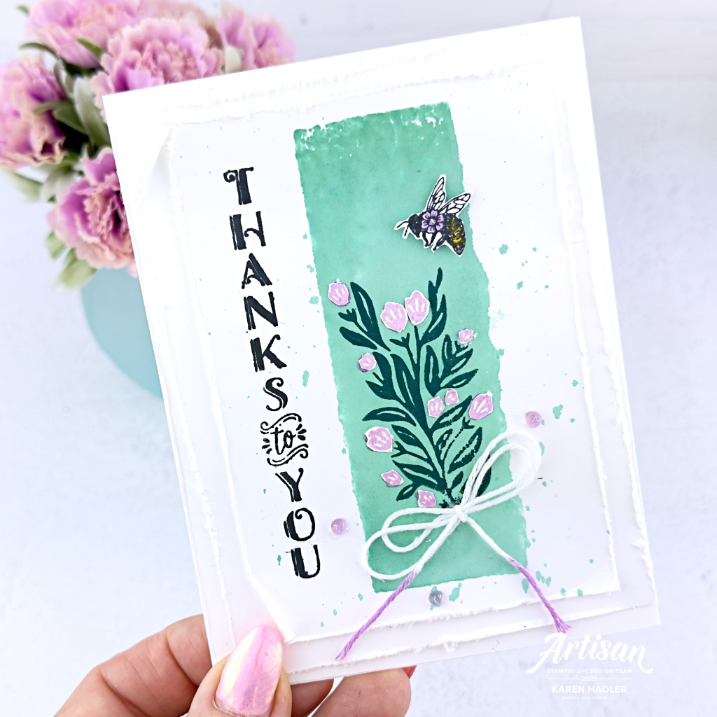 A greeting card that has Thanks to You Stamped vertically up the left hand side. In the middle is a Coastal Cabana Block of colour. On top of this is some greenery with Fresh Freesia flowers. There is also a Bee at the top of the flolwers. At the base of the flowers is a white bow.