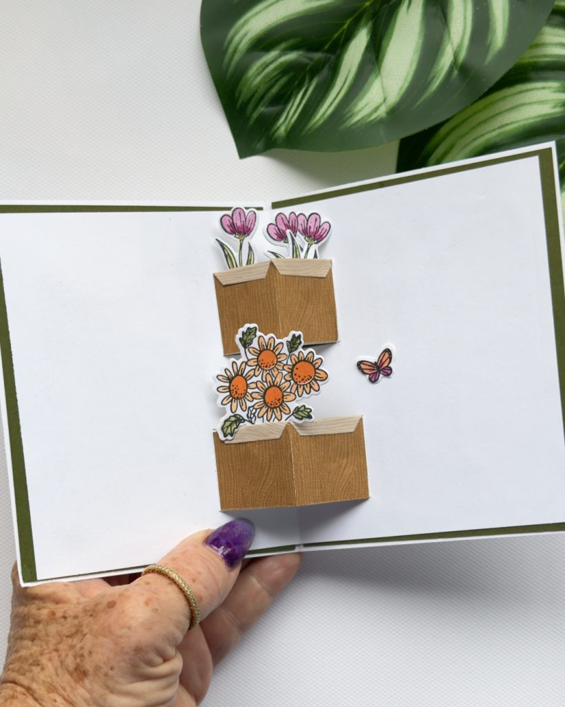 Interactive handmade card showing pop-up flower boxes with layered floral elements created using the Pop-Up Petals dies.