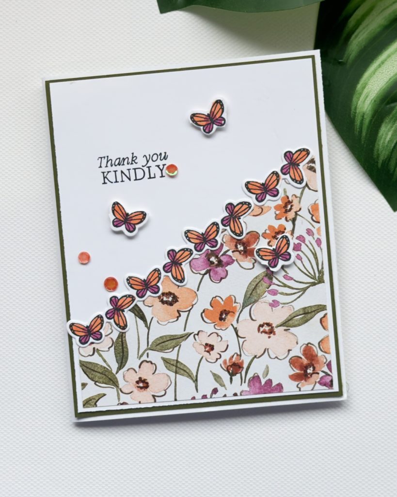 Elegant handmade thank you card with butterfly border, soft floral patterned paper and “Thank You Kindly” sentiment.