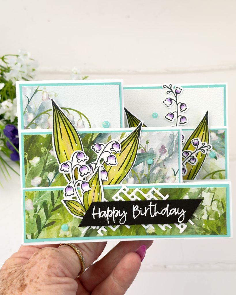 Double Z fold birthday card featuring Lily of the Valley flowers, layered designer paper, Coastal Cabana accents, and a black Happy Birthday sentiment.