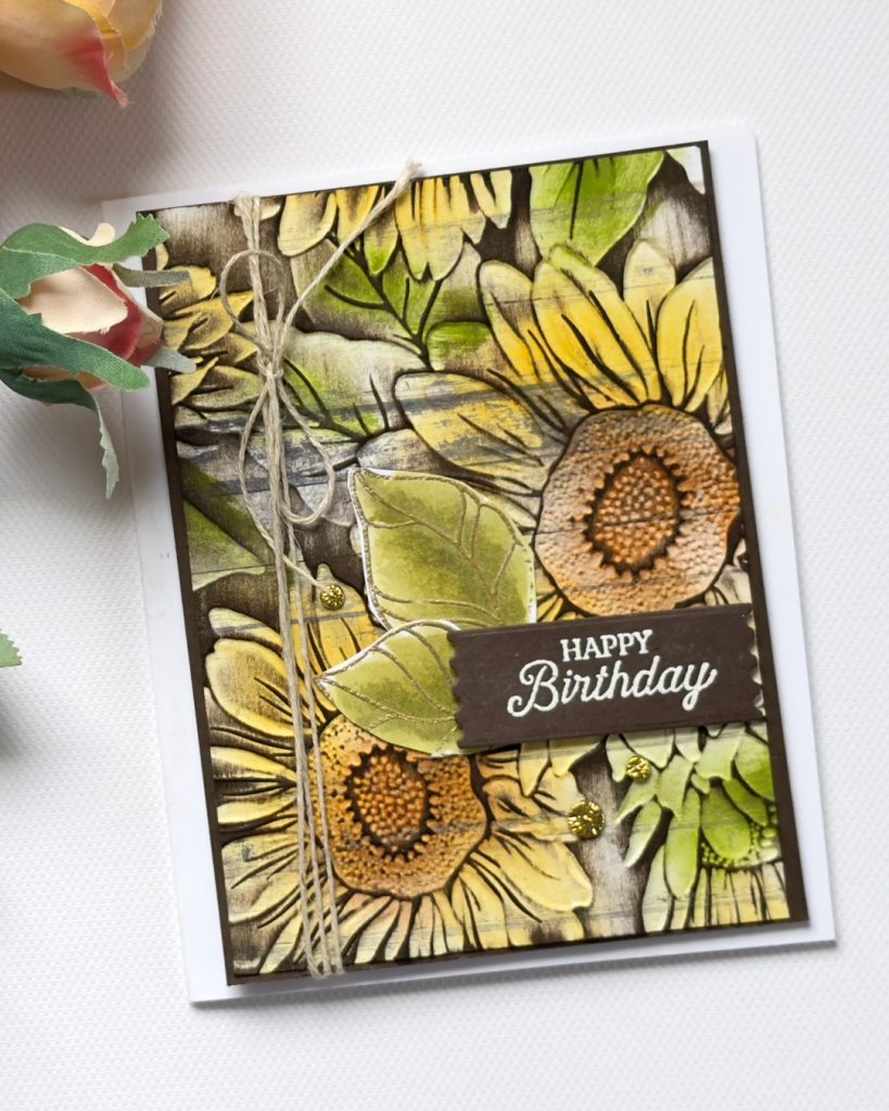 Sunflower embossed card on Country Woods designer paper with ink blending, rustic twine detail, and a layered birthday sentiment.