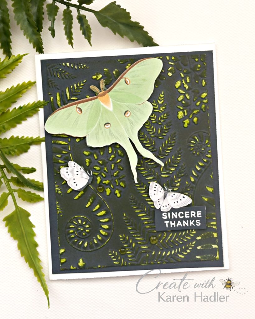 Dark embossed botanical handmade card with textured fern background, large green moth focal point, smaller moth embellishments and a “Sincere Thanks” sentiment.